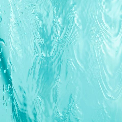 Calm water ripples on a serene light blue background.